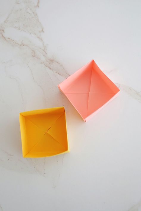 How to Make an Origami Box (with video!) - Childhood Magic Folded Boxes Diy, Making A Box With Paper, Tiny Paper Boxes Diy, Small Paper Boxes Diy, Diy Small Box For Gift, Paper Boxes Diy Folded Easy, How To Make A Box With Paper, Diy Paper Boxes Easy, Mini Box Template