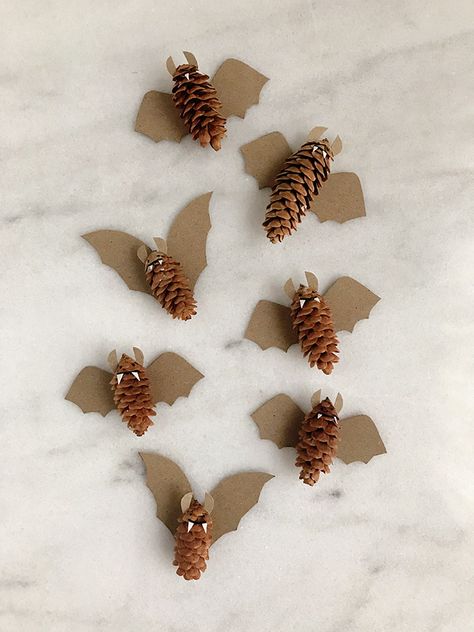 Pinecone Bats | Handmade Charlotte Diy Halloween Decorations Preschool, Halloween Decorations Natural, Diy Natural Halloween Decorations, Nature Halloween Decorations, Zero Waste Fall Decor, Autumn Nature Crafts, Halloween Nature Crafts, Pinecone Bats, Natural Halloween Decor