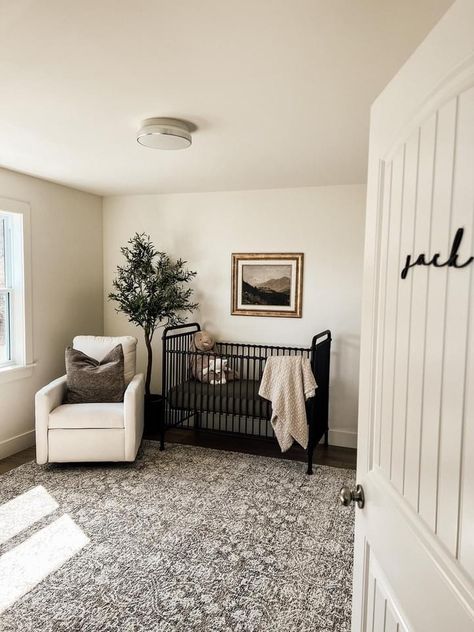 Nursery With Dark Wood Trim, Mixing Wood Tones Nursery, Nursery With Dark Carpet, Nursery With Dark Floors, Nursery Organic Modern, Organic Neutral Nursery, Tan Walls Nursery, Nursery With Fold Out Bed, Dark Floor Nursery Ideas