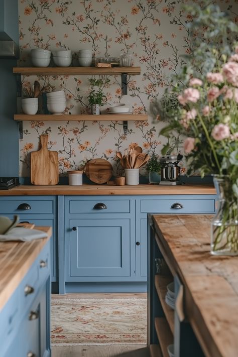 An English cottage kitchen brings warmth and charm with painted cabinets, floral patterns, and classic hardware. Perfect for anyone who loves a quaint, homey feel. #CottageKitchen #EnglishCharm Blue Kitchen Cottage, Sage And Blue Kitchen, Light Blue Cottage Kitchen, Blue And White Cottage Kitchen, English Cottage Dining Room Ideas, Colorful Small Kitchen, Quaint Kitchen Ideas, Colorful Cottage Kitchen, Blue Cottage Kitchen