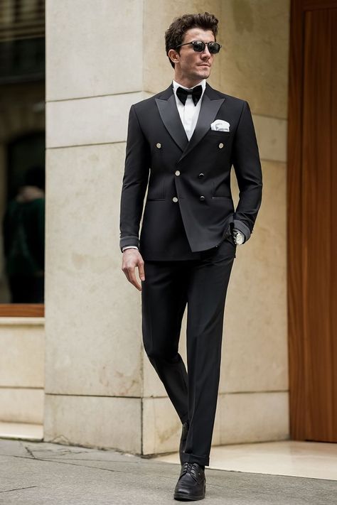 Our Black Tuxedo, crafted with meticulous attention to detail, this ensemble boasts a double-breasted jacket adorned with sleek satin lapels and subtle, modern touches. Paired with impeccably tailored trousers. Whether you're commanding the boardroom or stealing the show at a high-profile event, this tuxedo ensures you exude confidence.  #singlebreasted #suit #suits #slimfit #menstyle #menfashion #fashioninspo #formalwear #menclothing #formalattire #tuxedo #tuxedos #blacktuxedo Designer Coat Pent Men Suits, Black Tuxedo Suit For Men, Tucsido For Man, Double Breasted Black Tuxedo, Fashion Suits For Men Classy, Tuxedo Designs For Men, Men Tuxedo Styles, Men’s Tuxedo Style, Designer Tuxedo For Men