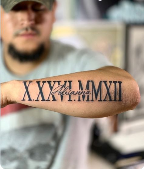 Roman Numeral With Name Tattoo, 1970 Roman Numeral Tattoo, Cool Name Tattoos Ideas, Arm Roman Numeral Tattoo, 1997 Tattoo Ideas Men, Name And Roman Numeral Tattoo, Date Tattoo Ideas Roman Numerals, Forearm Roman Numeral Tattoo, Birthday In Roman Numerals Tattoo