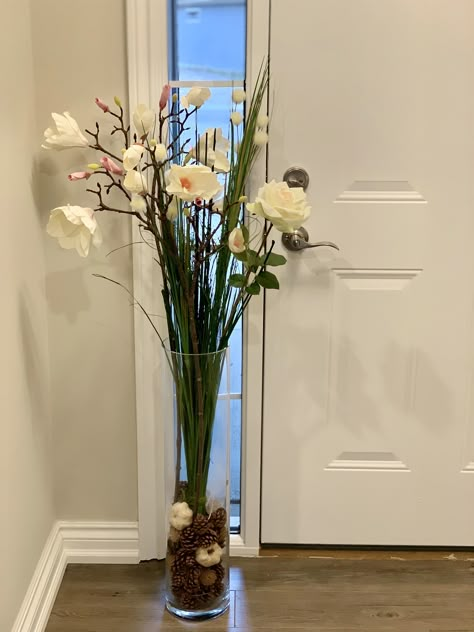 Fake Flower Arrangements In Tall Vase, Tall Glass Vases Decor Ideas, Clear Floor Vase Decor, Tall Plant Vase, Artificial Flower Arrangements Tall Vase, Big Clear Vase Decor Ideas, Large Cylinder Vase Decor, Flowers In Tall Vase, Long Glass Vase Decor Ideas