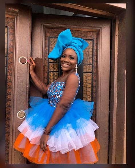 Stylaa! 💙🍬 Colour Struck💋! A belle looking dashing in a Ankara and 3 layered tulle gown🍬💙@stylaa.app 👈🏽follow & tag . . . 💃🏿 @peehem . . . #stylaa #africanqueen #naija #NigerianFashion #nigeria #colourfulankara #ankara #tulle #nigeriadesign #ankaracollection #asoebibella #blackbeauty #blue #net #minidress #shortdress #africanprint #corsetdress #gele #naijafashion #owambe #abujafashion #asoebi #asoebiafrica #ababe #lagos #lagosfashion Short Ankara Gowns With Net, Net Style Dresses In Nigeria, Ankara Gowns, Naija Fashion, Nigerian Styles, African Queen, Tulle Gown, Crochet Bags Purses, Lace Gown