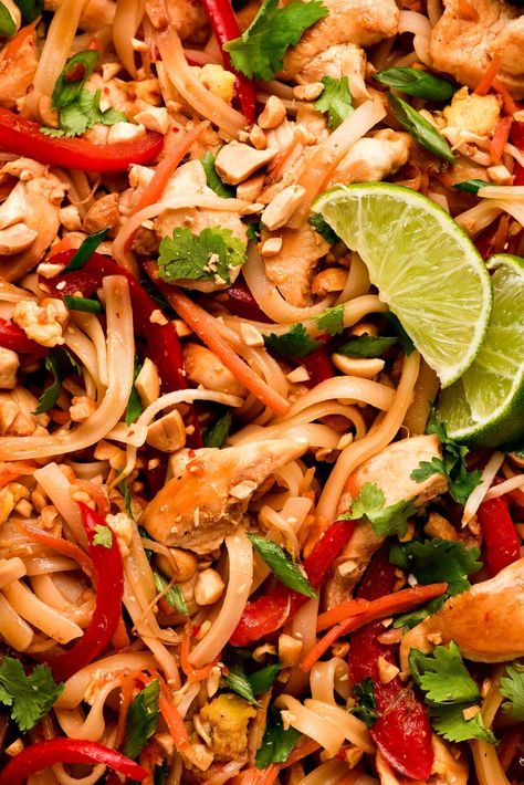 Chicken Pad Thai is a flavorful noodle stir-fry full of vegetables, chicken, rice noodles, eggs, and peanuts in a sweet and savory sauce. Make this popular dish at home in just 30 minutes! #thaifood #stirfry #asianrecipe | GarnishandGlaze.com Rice Noodle Chicken Stir Fry, Noodle Chicken Stir Fry, Thai Stir Fry Vegetables, Spicy Chicken Pad Thai, Chicken Pad Thai Recipe, Chicken Rice Noodles, Thai Rice Noodles, Chicken Pad Thai, Chicken With Rice