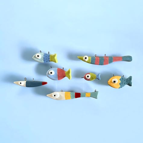 Once upon a time, in a cheerful ocean, a quirky and funky group of fish with amusingly whimsical looks danced through the waves, each one splashing a unique burst of color and personality. #fish #fishes #ocean #oceanlife #oceanlover #sealife #sealovers #pesci #pescirossi #ceramic #ceramicart #ceramics #fishnecklace #seainspired Fishes Ocean, Polymer Fish, 3d Clay Art, Fish Clay, Ideas For Clay, Clay Business, Lucky Fish, Fimo Art, Diy Animals