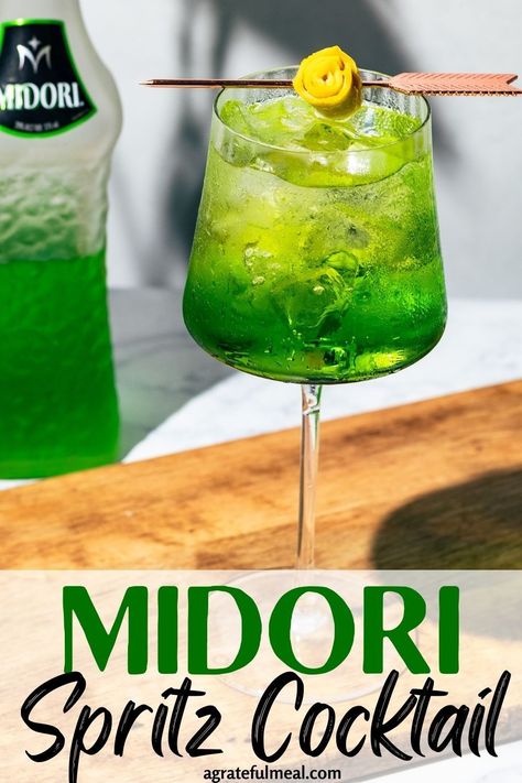 Looking for the perfect Midori cocktail? Look no further than our Midori Spritz! Made with sweet Midori melon liqueur, prosecco, and soda water, this drink is light, refreshing, and just the right amount of sweet. It's perfect for those hot summer days when you want a cool and delicious drink. Plus, the bright green color is sure to make a statement at any party or gathering. So if you're looking for a unique, refreshing cocktail to serve at your next party, give this Midori Spritz a try! Green Cocktail Recipes, Beginner Cocktails, Pink And Green Cocktail, Melon Spritz, Midori Shots, Midori Melon Drinks, Midori Cocktails Recipes, Melon Ball Drink, Midori Sour Cocktails