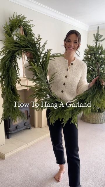 Garland On Fireplace Christmas, Wreath On Mantle Christmas, Bell Hanging Ideas, Mantle Christmas Garland Ideas, Christmas Decor With Garland, Mantle Garland With Bells, Fireplace With Garland, Norfolk Pine Garland Fireplace, Norfolk Pine Garland Mantle Decoration