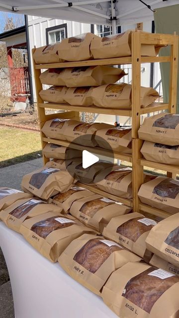 25K views · 2.6K likes | Little Pearl Breads & Bakes | Macey Merlak on Instagram: "🥖MY MICRO BAKERY PICKUP🥖 every week, i sell around 70 loaves of bread and tons of cookies/scones from my home-based micro bakery (licensed under cottage food law). here’s how i handle pickup day! *all my favorite micro bakery essentials, packaging, etc. are linked in my amazon storefront!* - i treat my pickup as if it were my own little storefront. i like the space to look inviting, professional, and aesthetically pleasing. i want my customers to enjoy the experience of picking up their weekly goodies! because i don’t have a covered porch, i set up a tent in my driveway. this creates a cozy enclosed space and also helps protect the baked goods from subsequent weather. i use my cute bread cooling racks, ta Bread Display Farmers Market, Bread Pop Up Display, Bread Display Rack, Diy Bread Display Rack, Home Bakery Pickup, Home Bakery Porch Pickup, Bread Stand Display, Sourdough Market Display, Porch Pickup Bakery