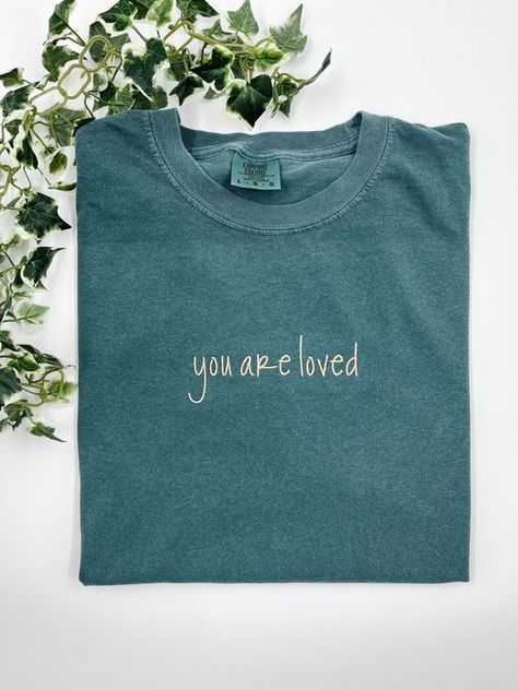 You are loved - Small / Comfort Color T-Shirt T shirt #tshirt t-shirt #t_shirt t shirts #tshirts t-shirts #t_shirts T shirt design #tshirtdesign T-shirt designs #t_shirtdesign T shirts designs #tshirtsdesigns 6.253 Comfort Colors Graphic Tees, Embroidered Tshirt Ideas, Embroidered Shirt Designs, T Shirt Embroidery Ideas, Embroidery Shirt Designs, Embroidered Tshirts, Jesus Clothes, Embroidery Business, Christian Shirts Designs