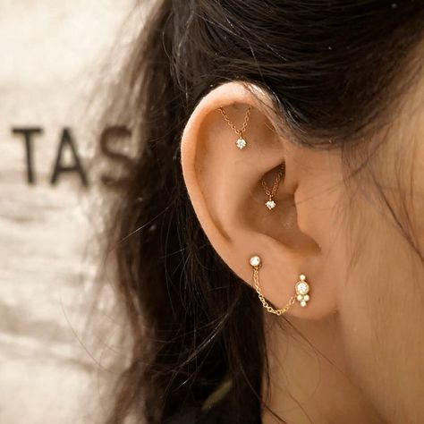 Maria Tash on Instagram: “Styling so good it should start a chain reaction. ⁠ Spotlight on our first client to get both the Tash Helix℠ and Tash Hidden Rook℠…” Stacked Lobes, Constellation Piercings, Ear Styling, The Dubai Mall, Unique Ear Piercings, Ear Peircings, Ear Curation, Ear Lobe Piercings, Piercings Earrings