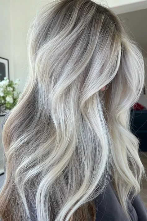 Woman with platinum balayage. Ash Blonde Balayage On Dark Hair Long, Ash Highlights On Blonde Hair, Honey Blonde And Platinum Highlights, Blonde With Brown Undertones, Hair Color With Silver Highlights, Icy Blonde With Root Melt, Blond Ash Balayage, Bright Blonde Root Melt, Blonde With Dark Brown Roots