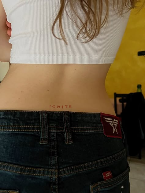 Back Red Tattoo Women, Ignite Me Tattoo Aaron Warner, Minimal Lower Back Tattoo, Lower Back Quote Tattoo, Ignite Tattoo Ideas, Shatter Me Tattoo Aaron Warner, Ignite Aaron Warner, Low Back Tattoo Women Words, Aaron Warner Ignite Tattoo