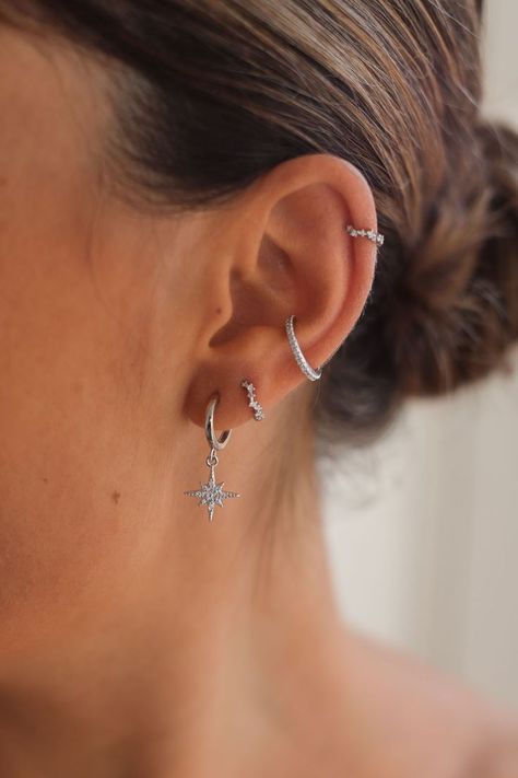 Create a gorgeous celestial inspired ear stack with Cartilage Cartel. Huggies, Hoops, Studs and Cuffs made with 925 Sterling Silver or 18 Carat Gold. #CELESTIALEARRINGS #CELESTIALJEWELERY #EARRINGS #EARSTACKING #CURATEDEARS #PIERCINGIDEAS Piercing Ideas Silver, Earring Inspo Silver, Earrings Aesthetic Silver, Silver Earring Stack, Summer Jewlery, Silver Earrings Aesthetic, Wishlist Board, Ear Stacking, Indian Queen