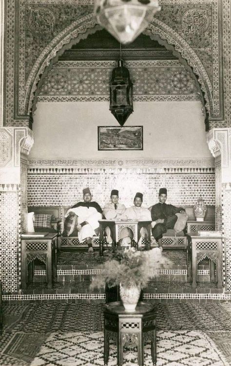 Dar Jamaï, Fez | A group of Moroccan men sitting inside Dar Jamaï, Morocco, 1935 | Moroccan architecture Moroccan Design Interior, Moroccan Men, Moroccan People, Moroccan Aesthetic, Moroccan Architecture, Senior Thesis, Fez Morocco, Classical House, Moroccan Art