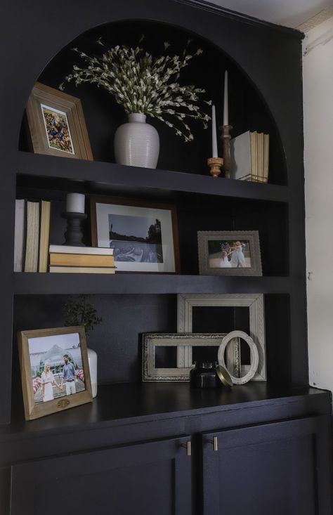 Black Shelves Styling, Black Bookshelf Styling Living Room, Dark Wood Bookcase Styling, Traditional Bookshelf Styling, Style Top Of Bookcase, How To Decorate Top Of Bookcase, Decorating Dark Bookshelves, Styling Dark Bookshelves, Black Bookcase Styling