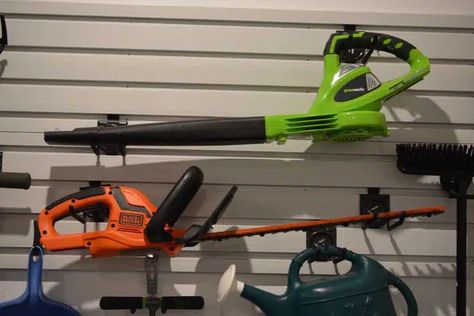 How To Hang A Leaf Blower In The Garage Leaf Blower Storage Ideas, Leaf Blower Storage, Garage Inspiration, Wall Storage Systems, Leaf Blowers, Garage Organize, Tool Room, Modular Walls, Spring Lake