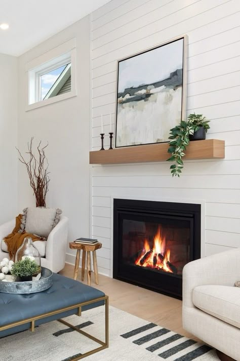 Fireplace, shiplap, white living room, floating mantle, square coffee table, coastal interior design. Fireplace Ideas Simple, California Coastal Fireplace, Coastal Cottage Fireplace, Floating Mantle Fireplace, White Shiplap Fireplace, Coastal Fireplaces, Fireplace Mantle Decor With Tv, Coastal Fireplace Ideas, Coffee Table Coastal