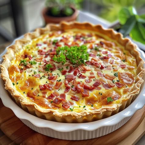 🥓 Savor the classic flavors of Quiche Lorraine, perfect for any meal! 🍽️ Quiche Lorraine 🛒 Ingredients: Pie crust: 1 Bacon: 100g, chopped Swiss cheese: 1 cup, shredded Eggs: 3 Cream: 1 cup Nutmeg: Pinch 👩‍🍳 Instructions: Prepare: Line a pie dish with crust. Cook bacon: Until crisp, set on crust, top with cheese. Mix: Whisk eggs, cream, and nutmeg. Pour over bacon. Bake: At 350°F for 30 minutes. 🍴 Experience the rich and comforting taste of our Quiche Lorraine. Perfect for brunch or dinner... Quiche Aesthetic, Swiss Food, Gourmet Food Plating, Quiche Recipes Easy, Quiche Recipes, Easy Baking Recipes, Swiss Cheese, Food Obsession, Beautiful Food