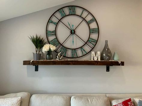 Big Wall Clock Decor Ideas Living Room, Decorating Around A Clock On The Wall, Wall Clock With Shelf Underneath, Wall Decor Around Big Clock, Living Room Wall Decor Ideas With Clock, Clock Above Sofa, Shelf Under Clock On Wall, Clock Placement In Living Room, Dining Room Wall Decor With Clock