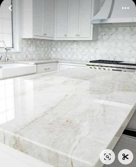 Calcutta Sol Quartz Countertops, White Quartz With Tan Veining, Warm Marble Countertops, White Kitchen White Countertops, Quartz Countertops With Wood Cabinets, White Marble Countertops Kitchen, Warm Quartz Kitchen Countertops, Most Popular Quartz Countertop Color, Kitchen Countertops With White Cabinets