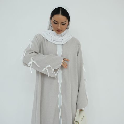 'ATARAH' Bow Knot Open Abaya Available in 3 colors (Blue, Pink and Gray) Shop now: 🔗https://eolanteclothing.com/products/front-open-ribbon-sleeves-abaya-atarah #ootd #modestfashion #eolanteclothing #modeststyle #modestclothing # #instafashion #modestoutfits #elegantmodesty #muslimahfashion #modestvibes #abayastyle #modestfashionblogger #summervibes #summerdress #bowknotabaya #ribbonabaya #openabayas Muslim Evening Dresses, Open Abaya, Dress Muslim, Flowing Fabric, Streetwear Shop, Formal Dresses For Weddings, Abaya Dress, Loungewear Women, Bow Knot