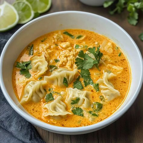 Try this quick and easy Thai Red Curry Dumpling Soup recipe! Packed with bold flavors, it's ready in 30 minutes and perfect for weeknights. Soup Recipes Curry, Thai Coconut Curry Dumpling Soup, Recipes For Illness, Thai Curry Dumpling Soup, Easy Thai Red Curry Dumpling Soup, Red Thai Curry Wonton Soup, Red Curry Dumpling Soup, Thai Red Curry Dumpling Soup, Red Curry Wonton Soup