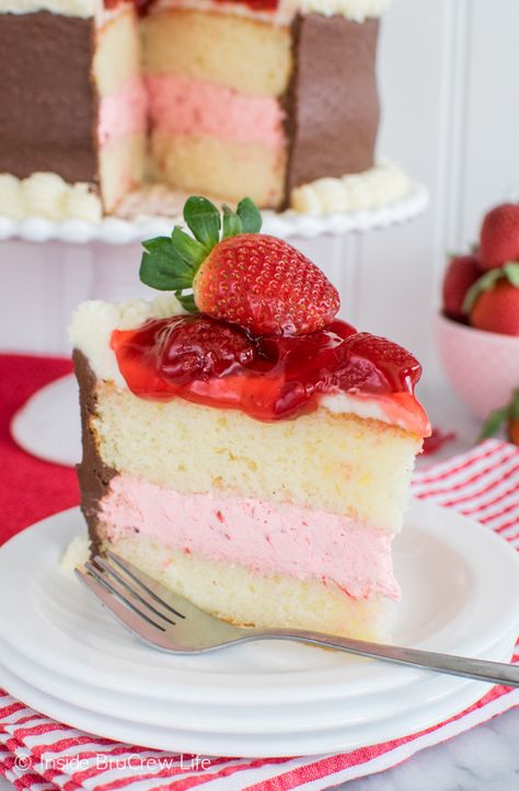 Layers of vanilla cake, strawberry pie filling, and chocolate frosting make this Strawberry Mousse Cake a delicious and pretty treat. Strawberry Mousse Filling, Vanilla Cake Strawberry, Strawberry Mousse Cake, Mousse Filling, Mousse Cake Recipe, Cake Filling Recipes, Strawberry Pie Filling, Cake With Strawberry, Recipes Strawberry