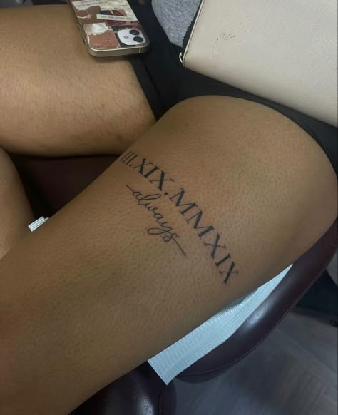 Thigh Tattoo Writing, Quote Tattoos For Women Meaningful, Name On Thigh, Boyfriend Tattoos For Women, Leg Word Tattoo, Side Of Foot Tattoos For Women, Partner Name Tattoos, Thigh Tattoos Women Words, Mid Thigh Tattoos Women