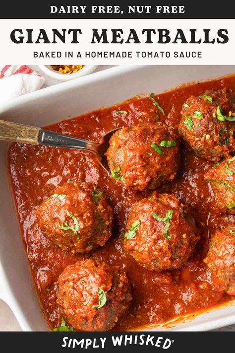 Outshine ordinary meatballs and go big with these extraordinary, giant meatballs baked in tomato sauce. These hearty and robust meatballs are larger than life and packed with incredible flavors. Smothered in a classic Italian tomato sauce, these meatballs can be served with or without your favorite pasta. Meatballs And Tomato Sauce, Meatball Gravy Recipe, Giant Meatballs, Tomato Sauce For Meatballs, Spanish Meatballs, Tomatoe Sauce, Meatballs Baked, Meatballs In Tomato Sauce, Meatballs And Gravy