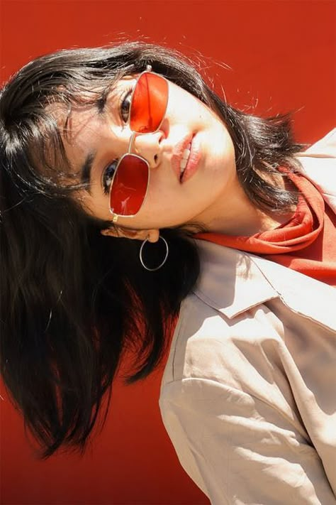 Tilting Sunglasses Down Reference, Sunglasses Women Photoshoot, Portrait With Sunglasses, Wearing Sunglasses Drawing Reference, Colored Sunglasses Outfit, Person With Sunglasses Reference, Sunglasses Pose Reference, Girl With Sunglasses Aesthetic, Red Sunglasses Aesthetic