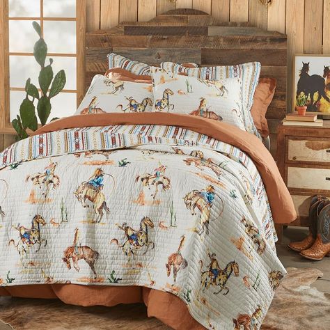 PRICES MAY VARY. ROD’S BRONCO VINTAGE WESTERN COWBOY QUILT: A timeless design that pays homage to the adventurous spirit of the frontier, this quilt pattern is inspired by the iconic bronco-riding cowboys of yesteryear. The pattern is enhanced by western motifs such as desert cacti in rustic hues of tan, rust, blue, and green. This reversible quilt features a vertical geometric striped pattern of crimson, gold, navy, and light blue on a warm, cream base. SOFT AND COMFORTABLE LUXURY: Made from 10 Bronco Vintage, Western Motifs, Cowboy Room, Cowboy Quilt, Western Quilts, Western Bedding, Western Bedroom, Cream Base, Quilt Comforter