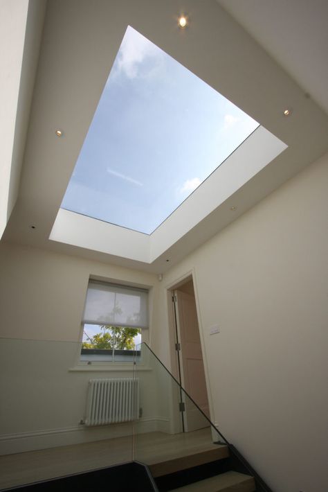 a frameless rooflight above stairwell of terrace london house Sky Light Ideas Glass Roof, Hall Skylight, Flat Roof Lights, Skylight Glass, Balcony Roof, Roof Skylight, Skylight Design, Roof Lights, Light Tunnel