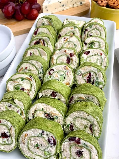 are filled with chicken, almonds, cranberries, green onions, and feta, rolled up in spinach tortillas. A great appetizer for parties -- and they taste even better than they look. As an Amazon Associate I earn from qualifying purchases. You’re going to love these This is such an easy recipe to make for game days or during the holiday season. And you'll be the hit of the party because everyone loves these tortilla roll-ups! Perfect finger food. Bring these tortilla pinwheel ap… Green Snacks For Color Party, Tortilla Pinwheel Appetizers, Chicken Cranberry Salad, Green Food Party, Green Buffet, Tortilla Pinwheels Recipe, Chicken Cranberry, St Patricks Food, Cream Cheese Pinwheels