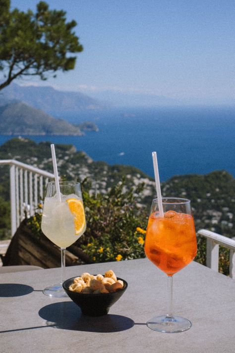 Stunning view for drinks in Capri Italy Capri Italy Aesthetic, Pizza Wedding, Talbots Summer, Italian Summer Aesthetic, Italy Beaches, Beach Drinks, Capri Italy, Italy Aesthetic, Italy Photo