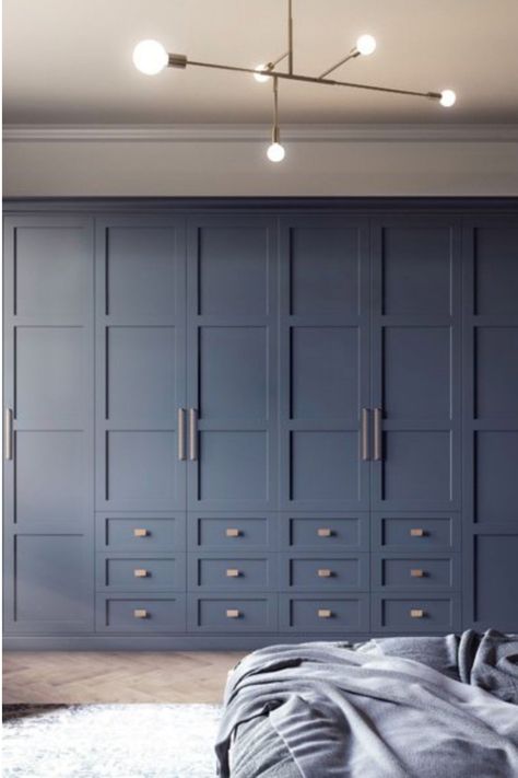 Our four panel shaker Elise design shown here in striking Classic Blue is new for 2020.  Our design team have created a fabulous door design available in 29 colours.  Classic Blue bedroom inspiration. New year, new bedroom. Shaker style bedrooms. Blue Bedrooms. Fitted wardrobes. Fitted bedrooms. Bedroom furniture. Blue Shaker Wardrobe, Wall To Wall Cupboards Bedroom, Blue Bedroom Cupboards, Shaker Bedroom Doors, Bedroom Builtin Wardrobes, Shaker Style Fitted Wardrobes, Shaker Style Wardrobes, Shaker Style Wardrobe Doors, Wall Of Wardrobes Bedroom