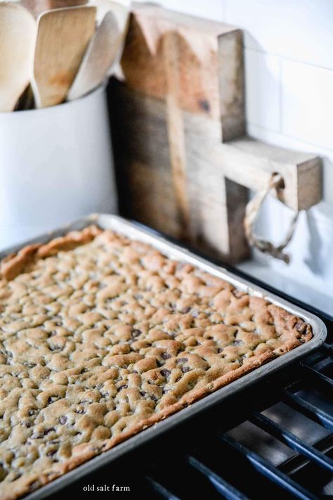 Rich and chewy sheet pan chocolate chip cookie bars have thick, crusty edges and a soft, chocolatey center. Easy to make and faster than traditional cookies! Chocolate Chip Pan Chewy, Chocolate Chip Cookie Bars 10x15, Choco Chip Cookie Bars, Cookie Sheet Recipes, Sheet Cookie Bars, Easy Jelly Roll Pan Bars, Chewy Chocolate Chip Bars, Cookie Sheet Cookies, Chocolate Chip Cookie Sheet Pan