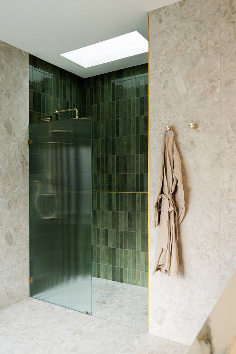 A glossy green feature tile, fluted glass shower screen and skylight above.  Sarah Carmel Design Studio offers both interior design and decorating services for Sydney homes and surrounds.  # Green Subway Tiles Bathroom, Bath And Shower Bathroom, Large Green Bathroom Tiles, Glass Shower Design, Ribbed Shower Screen, Green Tiles Bathroom Interior Design, Green Primary Bathroom, Textured Wall Bathroom, Shower With Skylight Above