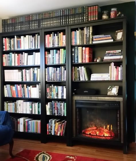 Materials: Two full-size and one narrow Hemnes bookshelves I had a spare wall in my living room, but wanted both a lot of book storage and a fireplace. I checked the dimensions of the Hemnes bookshelf, and discovered an electric fireplace insert that fit with just a little extra space. I used this AKDY 28 inch … Electric Fireplace Bookshelves Built In, Bookcase With Fireplace, Bookshelves Around Fireplace, Hemnes Bookcase, Fireplace Bookcase, Library Fireplace, Adventure Room, Guest Bedroom Remodel, Fireplace Bookshelves