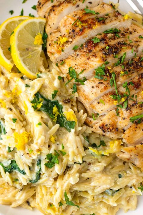 Lemon Chicken Orzo! This creamy one pot lemon chicken orzo is perfect for weeknights, and an amazing comfort food recipe. The orzo is tender, and it's tossed with fresh lemon and spinach. Lemon Chicken Orzo Skillet, Chicken Lemon Orzo Pasta, Lemon Orzo With Chicken, Lemon Chicken With Orzo Recipe, Lemon Garlic Chicken Orzo, Sides For Lemon Chicken, Creamy Parmesan Chicken And Orzo, Chicken Breast And Orzo Recipes, Lemon Chicken Orzo Crockpot Recipes