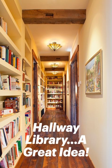 A hallway is a great place to create a library. The built in shelving and textural beams as well as ambient lighting create a rustic atmosphere. #homelibrary #hallwaylibrary #hallwaydesignideas Hall Library Bookshelves, Built In Bookshelves Doorway, Library Hallway Bookshelves, Hallway With Bookshelves, Bookcase In Hallway, Hallway Library Ideas Narrow, Built In Hallway Shelves, Narrow Hallway Bookshelves, Hallway Library Narrow