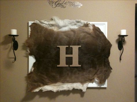 Deer skin mounted on frame with monogram... A unique way to integrate your hubby's hunting trophy with the decor Deer Hide Wall Hanging, Ways To Display Deer Mounts, How To Decorate With Animal Hides, Axis Deer Decor, Deer Hide Decor, Animal Hide Decor, Cool Deer Mounts, Boys Hunting Bedroom, Tanning Deer Hide