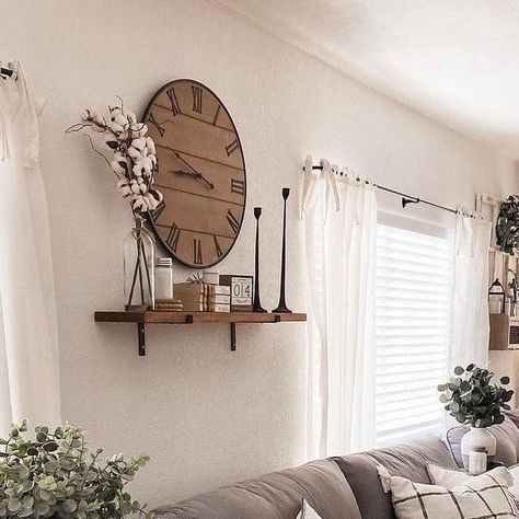 Farmhouse Is My Style on Instagram: "The heart of farmhouse charm 🌾🏡 is perfectly captured in this cozy living space! The neutral tones create a soothing atmosphere, while the mix of textures adds a touch of rustic elegance. The large clock 🕰️ and the delicate greenery 🌿 bring a fresh, inviting vibe. This is the ideal spot to relax and unwind after a long day. (Photo Credit: @amadadecor)  #FarmhouseStyle #CozyLiving #RusticCharm #NeutralDecor #HomeSweetHome" Decor For Above Tv Living Rooms, Big Clock Wall Decor, Living Room Wall Decor With Clock, Big Wall Clock Decor Ideas, Large Clock Wall Decor Living Rooms, Clock Wall Decor Layout, Large Wall Clock Decor Ideas, Big Wall Clocks Living Rooms, Clock In Living Room