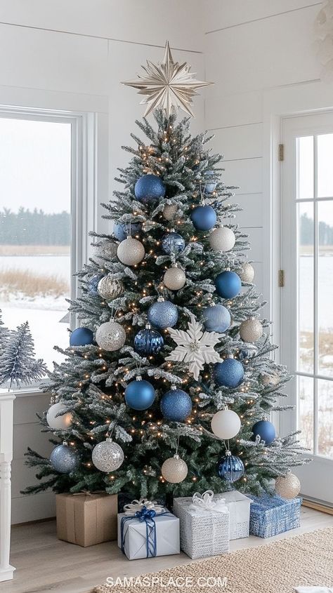 Discover 21+ gorgeous Christmas tree ideas for 2024 to make your home sparkle this season! Create a timeless look with classic red and green decor or opt for a chic vibe with silver, gold, or rose gold ornaments. For a cozy feel, try a rustic farmhouse theme featuring burlap ribbons and wooden accents. #ChristmasTreeDecor #HolidayTreeIdeas #Christmas2024Decor #FestiveTreeInspo White Silver And Blue Christmas Tree, Christmas Tree Color Schemes Blue, Christmas Tree Ideas Light Blue, Blue Xmas Tree Decorating Ideas, Blue Silver And Gold Christmas Tree, Christmas Tree Ideas Blue And Silver, Themed Christmas Tree Ideas Color Schemes, Blue Themed Christmas Tree, Blue And Silver Christmas Tree Ideas