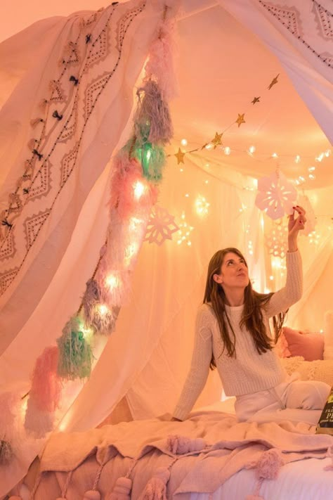 How To Make A Magical Holiday Tent at Home | studiodiy.com Kids Tents Indoor With Lights, Make A Tent With Sheets, The Holiday Tent, Diy Kids Tent Indoor, Indoor Tent For Kids Sleepover, Bedroom Tent Ideas, Indoor Tent Romantic, How To Make A Tent, Tent In Bedroom