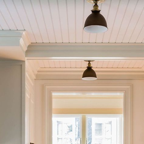 Carpenter & MacNeille on Instagram: "A crisp, white, beadboard ceiling and C&M custom cabinetry enhance the classic cottage aesthetic of this renovated 1920s home by the sea.⁠ ⁠ Project: Lobster Cove⁠ Photographer:@michaeljleephotography⁠ ⁠ #restoration #architecture #oceanhome #renovation #customcabinetry #beadboard" Beadboard Panel Ceiling, Bead Board On Ceiling, Bead Board Ceiling With Beams, Beadboard Kitchen Ceiling, Vertical Beadboard Walls, Beadboard Stairs, Painted Beadboard Ceiling, Beadboard On Ceiling, Cream Beadboard