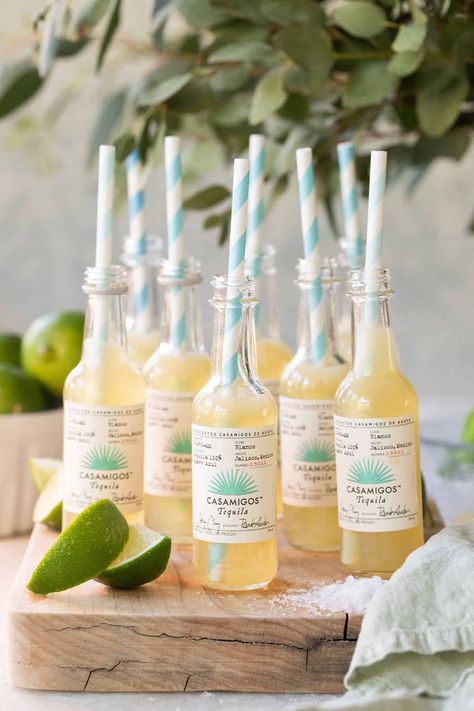 These margarita shots are made with fresh ingredients and served in mini tequila bottles! These are perfect for parties! Margaritas And Senoritas Party, Tequila And Tacos Party, Margarita Night Party Food, Tequila And Tacos Party Ideas, Margarita Birthday Theme, Margarita Party Theme, Tacos And Tequila Bridal Shower Ideas, Margarita Station Parties, Mini Patron Margaritas