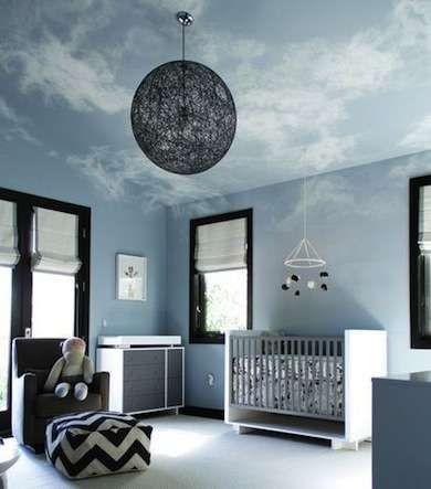 In the Clouds The extreme angles of dormered ceilings can make a room feel tight, but painted clouds on the ceiling and upper walls softened the edges for an airy look. The white clouds add a feeling of expansiveness to a simple and clean blue-and-black room. Baby Boy Room Nursery, Nursery Room Boy, Blue Nursery, Baby Bedroom, Baby's Room, Modern Nursery, Baby Boy Rooms, Nursery Design, Contemporary Bedroom