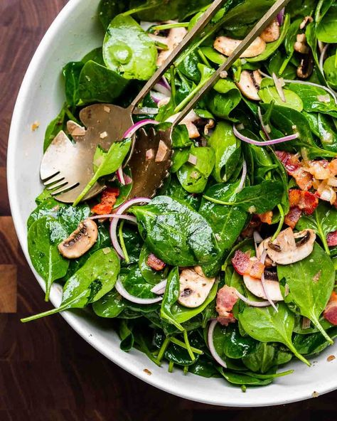 Spinach salad with hot bacon dressing combines baby spinach, crispy bacon, sliced red onion, and mushrooms tossed together with a hot honey Dijon bacon dressing. This salad is a hit at gatherings but is equally great for weeknights at home. #spinachsalad #spinachandbaconsalad #saladrecipes Hot Mushroom Salad, Hot Spinach Salad With Bacon, Warm Spinach Salad With Bacon, Warm Bacon Spinach Salad, Spinach Mushroom Salad, Spinach Salad With Hot Bacon Dressing, Spinach Salad Dressing Vinaigrette, Hot Bacon Dressing For Spinach Salad, Spinach Salad With Warm Bacon Dressing