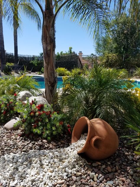 Rock landscaping. Yard art. Spilled pot of rocks. Pot With Rocks Spilling Out, Landscaping With Rocks Pots & Planters, Spilled Flower Pot Ideas Rocks, Spilling Pots Ideas, Spilled Pot Ideas, Spill Pot Garden Ideas, Rocks Spilling Out Of Pot Planters, Spilled Pot Landscaping, Desert Landscape Design